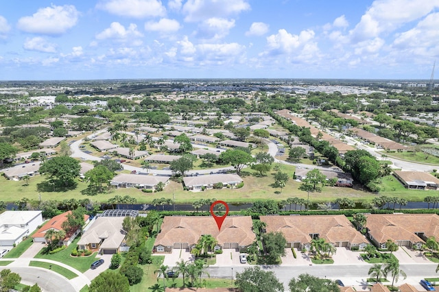 aerial view of property and surrounding area with nearby suburban area