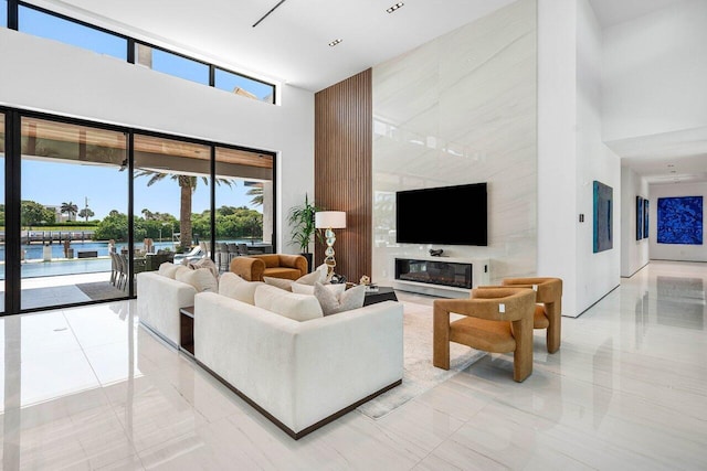 4460 NE 31st Ave, Lighthouse Point, FL 33064 - living area featuring a high ceiling and light tile patterned floors