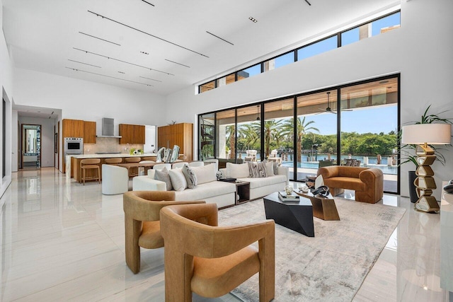 4460 NE 31st Ave, Lighthouse Point, FL 33064 - living area featuring a high ceiling