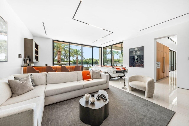 4460 NE 31st Ave, Lighthouse Point, FL 33064 - living room with floor to ceiling windows and light tile patterned floors