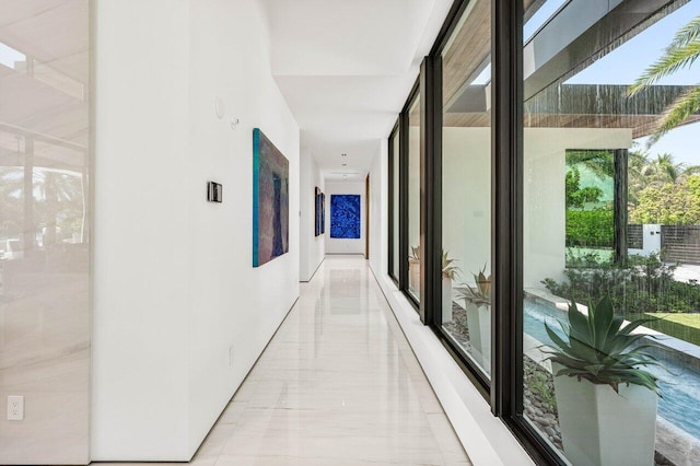 4460 NE 31st Ave, Lighthouse Point, FL 33064 - hallway with light marble finish floors