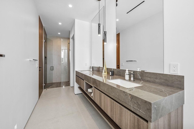 4460 NE 31st Ave, Lighthouse Point, FL 33064 - bathroom featuring double vanity, a shower stall, and recessed lighting