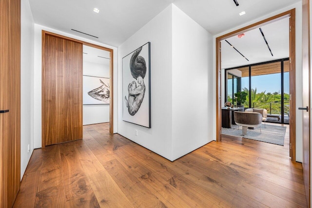 4460 NE 31st Ave, Lighthouse Point, FL 33064 - corridor with floor to ceiling windows and wood finished floors