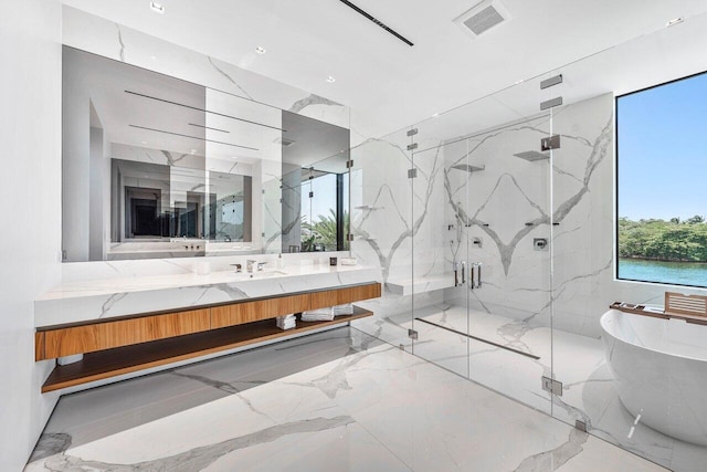 4460 NE 31st Ave, Lighthouse Point, FL 33064 - bathroom featuring marble tiled floors, a soaking tub, and a marble finish shower