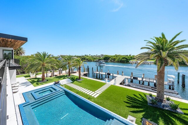 4460 NE 31st Ave, Lighthouse Point, FL 33064 - view of pool featuring a water view, a boat dock, an in-ground hot tub, and a lawn