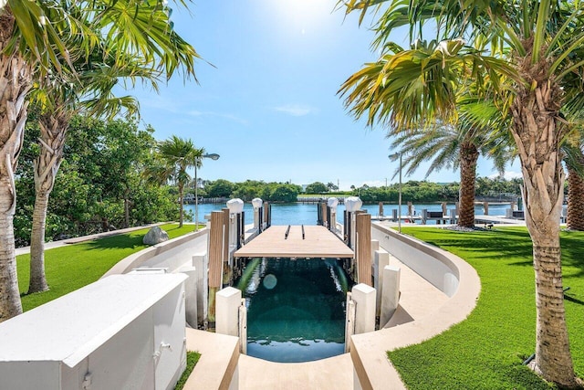 4460 NE 31st Ave, Lighthouse Point, FL 33064 - view of pool featuring a boat dock, a water view, and a lawn