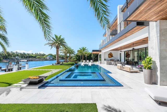 4460 NE 31st Ave, Lighthouse Point, FL 33064 - view of pool with a patio area, a water view, a yard, a dock, and an outdoor living space with a fire pit