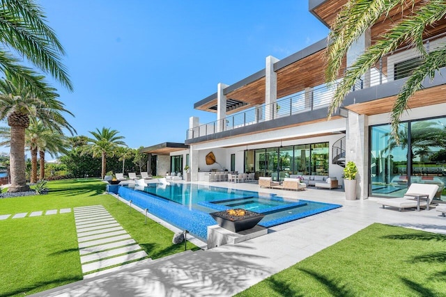 4460 NE 31st Ave, Lighthouse Point, FL 33064 - view of pool with outdoor lounge area, a patio, a yard, and an infinity pool