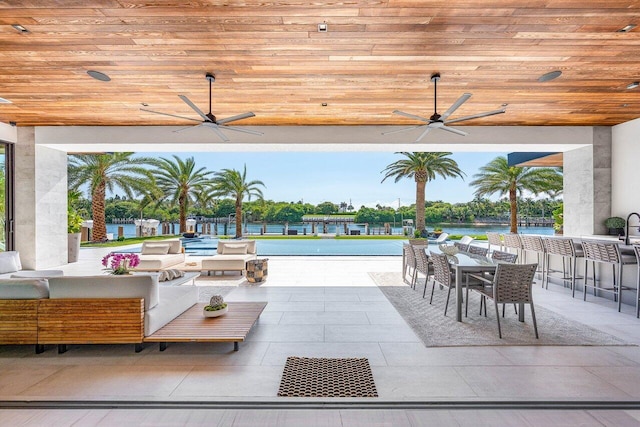 4460 NE 31st Ave, Lighthouse Point, FL 33064 - view of patio with a ceiling fan, an outdoor hangout area, outdoor dining area, and a water view