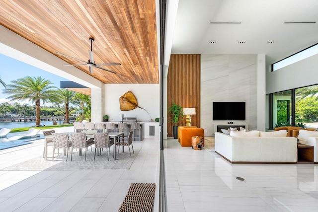 4460 NE 31st Ave, Lighthouse Point, FL 33064 - living area with a towering ceiling, a ceiling fan, a water view, and wooden ceiling