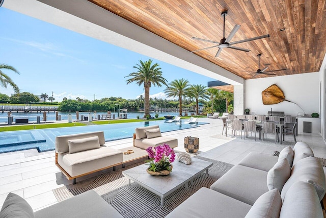 4460 NE 31st Ave, Lighthouse Point, FL 33064 - view of patio featuring an outdoor hangout area, a bar, ceiling fan, an outdoor pool, and grilling area