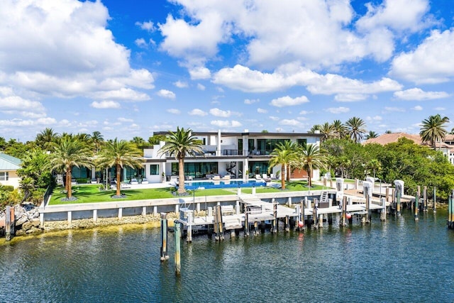 4460 NE 31st Ave, Lighthouse Point, FL 33064 - back of property with boat lift, a water view, a pool, and a balcony