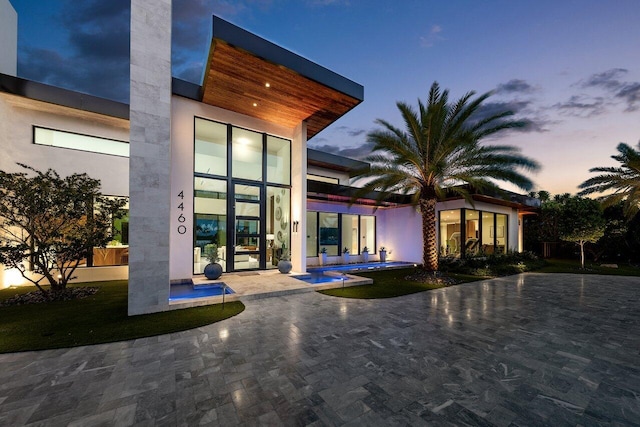 4460 NE 31st Ave, Lighthouse Point, FL 33064 - back of house with a patio and an outdoor pool