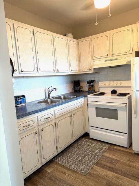 3362 Cynthia Ln Unit 211, Lake Worth Beach, FL 33461 - kitchen with white appliances, under cabinet range hood, a sink, and tasteful backsplash