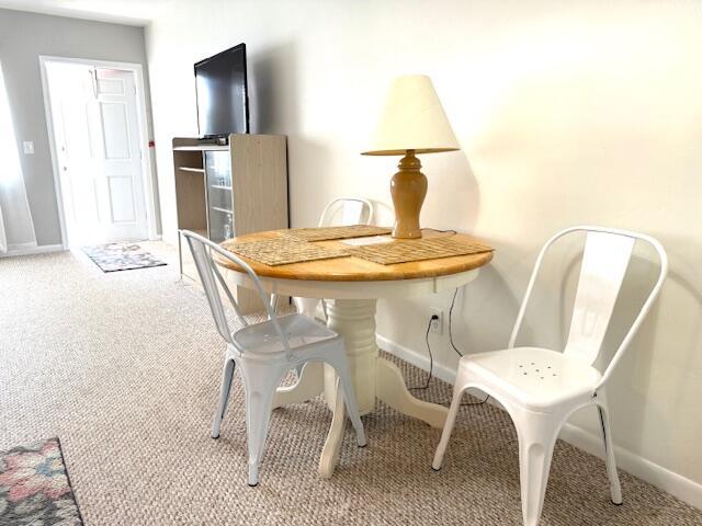 3362 Cynthia Ln Unit 211, Lake Worth Beach, FL 33461 - dining space with light carpet and baseboards