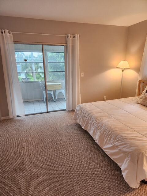 3362 Cynthia Ln Unit 211, Lake Worth Beach, FL 33461 - carpeted bedroom featuring access to outside