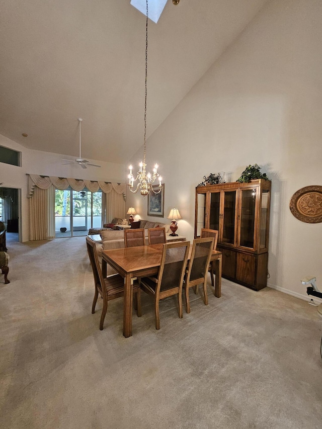 1639 SW Harbour Isles Cir Unit 29, Port Saint Lucie, FL 34986 - dining area featuring light carpet, high vaulted ceiling, a chandelier, baseboards, and ceiling fan