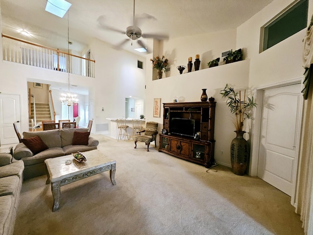 1639 SW Harbour Isles Cir Unit 29, Port Saint Lucie, FL 34986 - living room featuring ceiling fan, carpet flooring, a towering ceiling, a chandelier, and stairs
