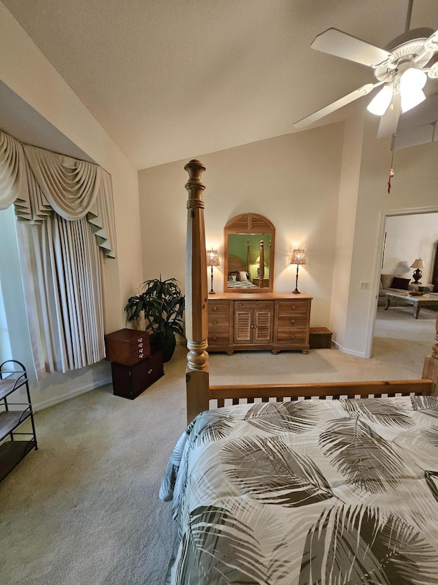 1639 SW Harbour Isles Cir Unit 29, Port Saint Lucie, FL 34986 - bedroom featuring light carpet, lofted ceiling, and a ceiling fan