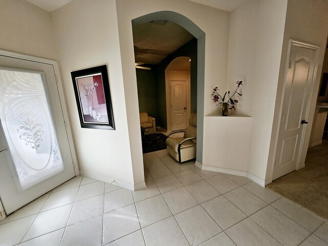1639 SW Harbour Isles Cir Unit 29, Port Saint Lucie, FL 34986 - foyer with a ceiling fan, light tile patterned flooring, and baseboards