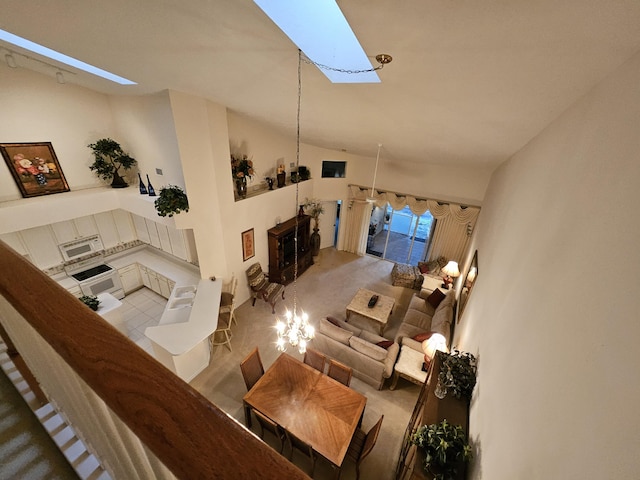 1639 SW Harbour Isles Cir Unit 29, Port Saint Lucie, FL 34986 - living area featuring a skylight and vaulted ceiling