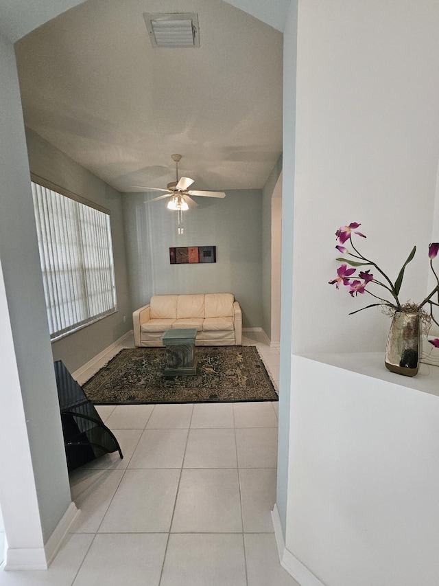 1639 SW Harbour Isles Cir Unit 29, Port Saint Lucie, FL 34986 - living area with tile patterned floors, ceiling fan, and baseboards