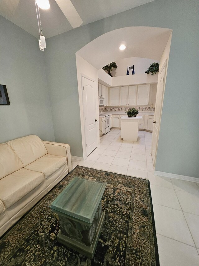 1639 SW Harbour Isles Cir Unit 29, Port Saint Lucie, FL 34986 - living room featuring light tile patterned floors and baseboards