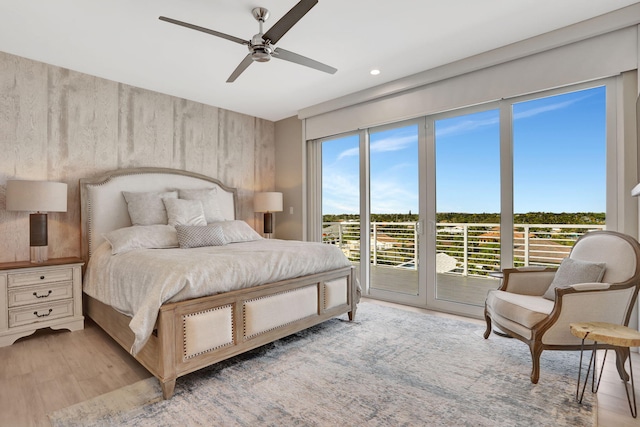 bedroom featuring access to outside, light wood-type flooring, a ceiling fan, and recessed lighting