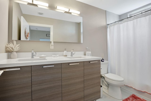 full bathroom featuring toilet, tile patterned flooring, double vanity, and a shower with curtain