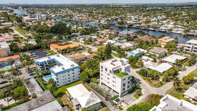 aerial view of residential area with a nearby body of water