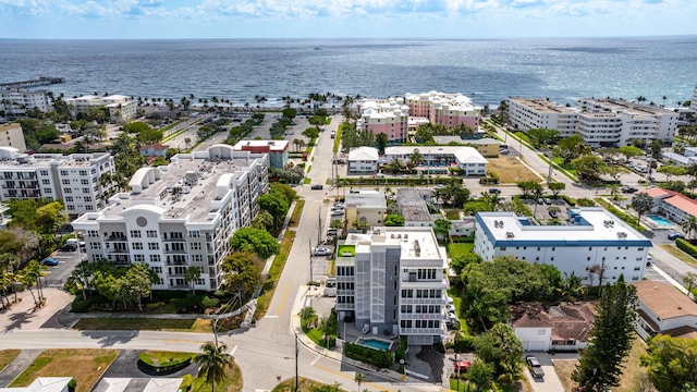 aerial view of apartment complex / building and a nearby body of water