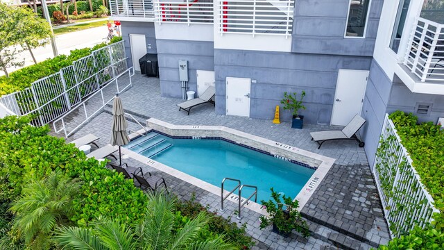 community pool with a patio