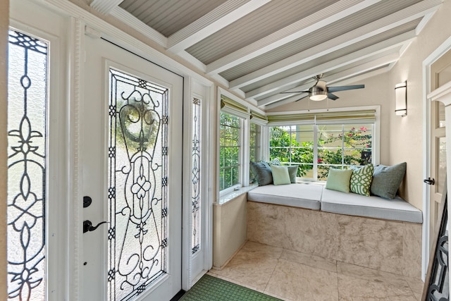 sunroom featuring a ceiling fan