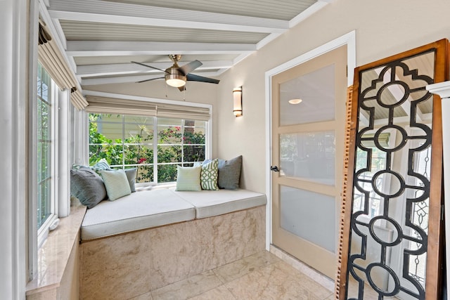 sunroom / solarium featuring a ceiling fan