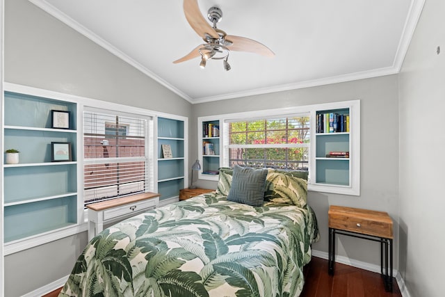 bedroom with lofted ceiling, wood finished floors, baseboards, a ceiling fan, and ornamental molding