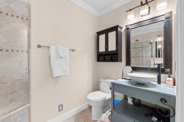 full bathroom featuring crown molding, toilet, tiled shower, a sink, and tile patterned flooring