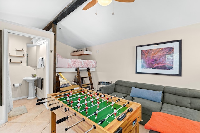 playroom featuring light tile patterned floors, a sink, and a ceiling fan