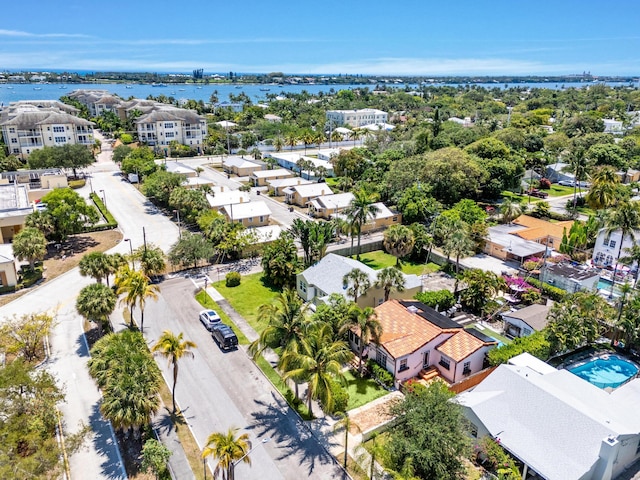 aerial view of residential area with a large body of water