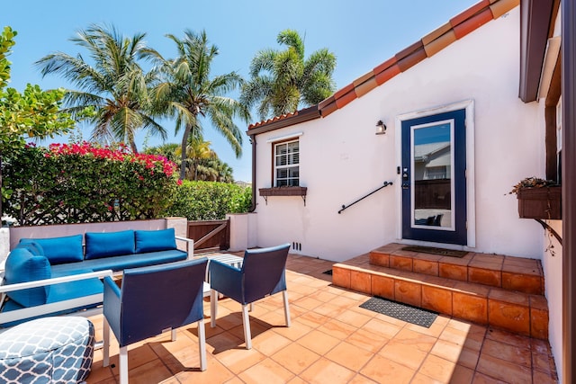 view of patio / terrace with outdoor lounge area and fence