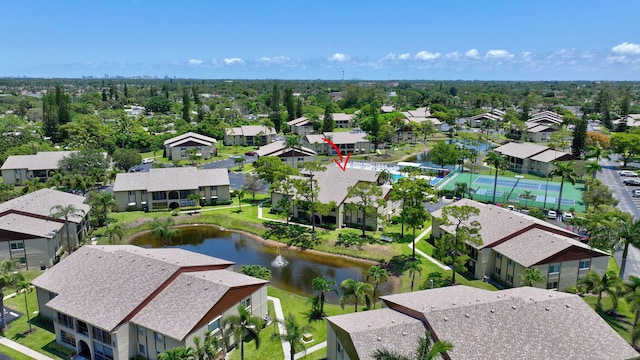 aerial perspective of suburban area with a large body of water