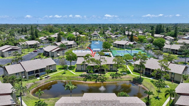 aerial perspective of suburban area featuring a nearby body of water