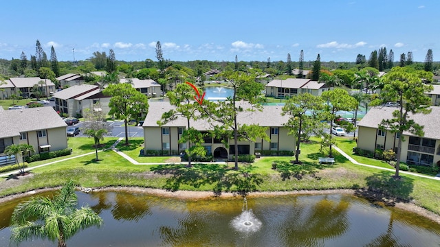 aerial perspective of suburban area with a nearby body of water