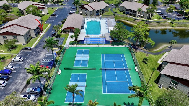 view of property location featuring a pool area and a large body of water