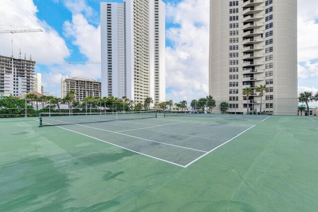 view of tennis court with fence
