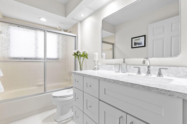 701 Sea Oats Dr Unit A-4, Juno Beach, FL 33408 - full bath with vanity, bath / shower combo with glass door, recessed lighting, and tile patterned flooring