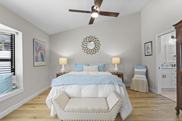 701 Sea Oats Dr Unit A-4, Juno Beach, FL 33408 - bedroom with lofted ceiling, light wood finished floors, ensuite bath, and ceiling fan