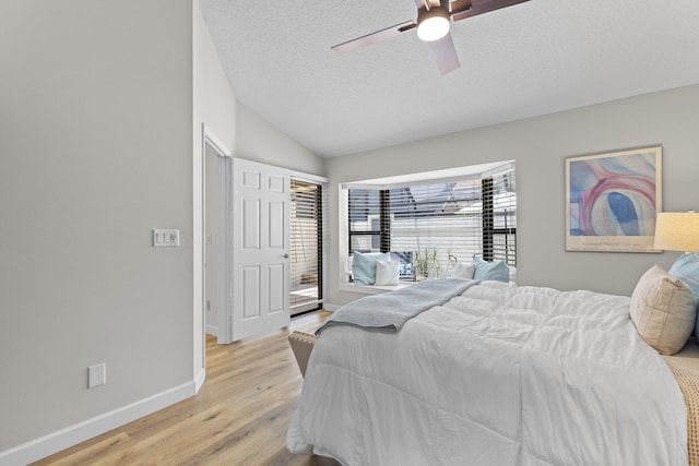 701 Sea Oats Dr Unit A-4, Juno Beach, FL 33408 - bedroom with light wood-style floors, lofted ceiling, a textured ceiling, and ceiling fan