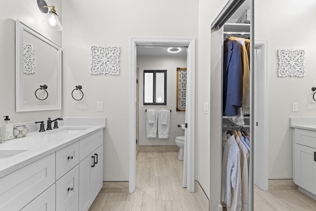701 Sea Oats Dr Unit A-4, Juno Beach, FL 33408 - bathroom featuring double vanity and a walk in closet