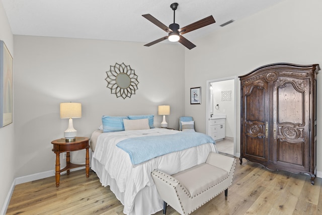 701 Sea Oats Dr Unit A-4, Juno Beach, FL 33408 - bedroom with light wood-type flooring, lofted ceiling, ensuite bath, and ceiling fan