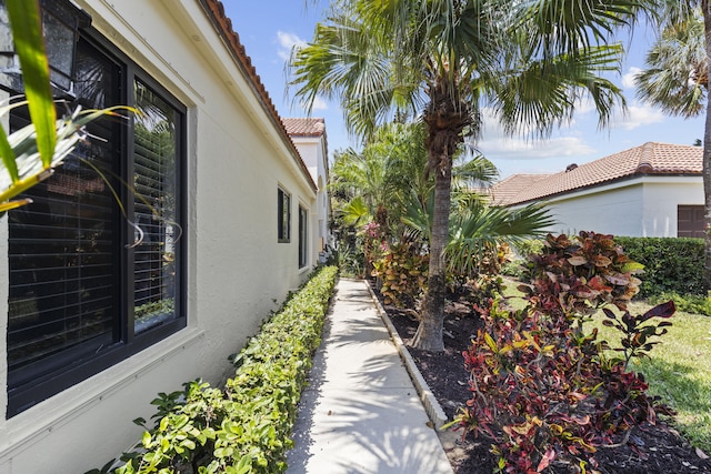 701 Sea Oats Dr Unit A-4, Juno Beach, FL 33408 - view of home's exterior with stucco siding and a tile roof